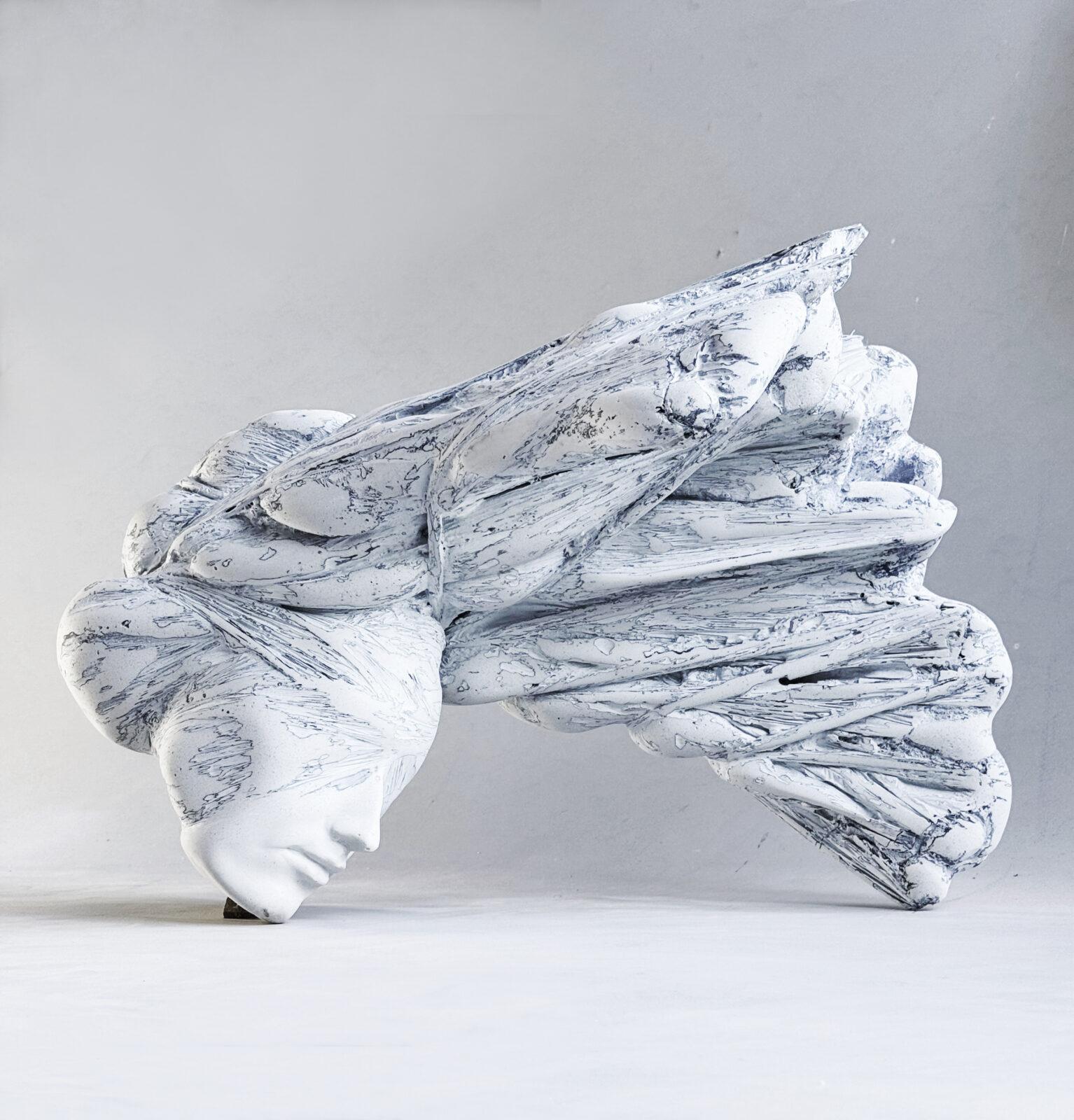 A woman with fantastic antlers – a trophy. Marble powder and resin abstract sculpture by Aleksandra Piasecka